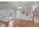 Dining room with hardwood floors, natural light, and access to the outdoor space at 1144 Survada Ln, Morrisville, NC 27560