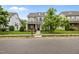 Traditional two-story home with manicured front lawn and landscaping, including a charming tree in the yard at 1144 Survada Ln, Morrisville, NC 27560