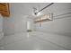 Large garage with epoxy floors, storage racks, and an automatic door opener at 1144 Survada Ln, Morrisville, NC 27560