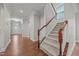 Open hallway with hardwood floors, a staircase, and plenty of natural light at 1144 Survada Ln, Morrisville, NC 27560
