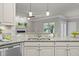 Bright kitchen featuring stainless steel appliances, granite countertops, and neutral-toned cabinetry at 1144 Survada Ln, Morrisville, NC 27560