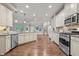 Open kitchen featuring stainless steel appliances and granite countertops at 1144 Survada Ln, Morrisville, NC 27560