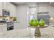 Spacious kitchen with stainless steel appliances, granite countertops and breakfast bar for casual dining at 1144 Survada Ln, Morrisville, NC 27560