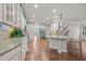 Spacious kitchen with a central island, stainless steel appliances, and granite counters at 1144 Survada Ln, Morrisville, NC 27560