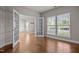 Bright and airy living space with hardwood floors, large windows, and french doors at 1144 Survada Ln, Morrisville, NC 27560