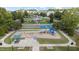 Inviting playground with swings, slide, picnic tables, and covered benches for Gathering fun at 1144 Survada Ln, Morrisville, NC 27560