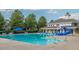 Community pool with chairs, a slide, and well-manicured landscaping, ideal for relaxation and recreation at 1144 Survada Ln, Morrisville, NC 27560