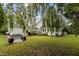 Expansive backyard with a patio and an upper deck, perfect for outdoor living at 1146 Rogers Rd, Graham, NC 27253