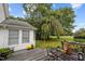 Inviting deck area features outdoor seating and scenic backyard views at 1146 Rogers Rd, Graham, NC 27253