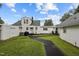 Wide view of the back of this charming home, showcasing a pleasant backyard at 1146 Rogers Rd, Graham, NC 27253