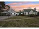 Well-maintained single-story home with a lush green lawn and covered parking at 1146 Rogers Rd, Graham, NC 27253