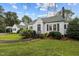 A charming home with lush landscaping and dark shutters at 1146 Rogers Rd, Graham, NC 27253