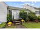 Inviting front porch with decorative plants and charming details at 1146 Rogers Rd, Graham, NC 27253