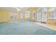 Spacious living room with arched windows and doors offering ample natural light at 1146 Rogers Rd, Graham, NC 27253