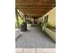 Backyard with gravel floor, wood ceiling, a grill, and various equipment for recreation and maintenance at 121 Flint Point Ln, Holly Springs, NC 27540