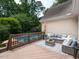 Inviting outdoor deck with stylish seating and a view of the sparkling swimming pool at 121 Flint Point Ln, Holly Springs, NC 27540