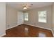 Bedroom featuring wood flooring, a ceiling fan, and a closet with double doors at 1215 Brookgreen Dr, Cary, NC 27511