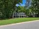 Charming home with a covered front porch and well-manicured lawn, offering a blend of comfort and curb appeal at 1215 Brookgreen Dr, Cary, NC 27511