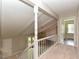 Hallway overlooking living room, with view of the deck, stairs, and bedrooms at 1215 Brookgreen Dr, Cary, NC 27511