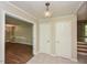 Hallway with tile flooring, white doors, and a chandelier at 1215 Brookgreen Dr, Cary, NC 27511