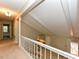Second floor hallway shows stairs down to the living area and access to bedrooms at 1215 Brookgreen Dr, Cary, NC 27511