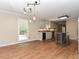 Open floor plan featuring a kitchen with a center island and stainless steel appliances at 1215 Brookgreen Dr, Cary, NC 27511