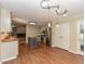 Kitchen with modern appliances, granite countertops, and island with stools at 1215 Brookgreen Dr, Cary, NC 27511