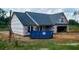 New home construction showcasing siding and garage area at 123 Maple Dr, Erwin, NC 28339