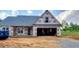 New home under construction, showing the exterior, roof and garage at 123 Maple Dr, Erwin, NC 28339