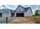 View of new home being constructed, showing facade and garage at 123 Maple Dr, Erwin, NC 28339