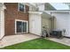 Fenced backyard with turf, slider door, and storage building at 129 Assembly Ct, Cary, NC 27511