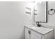 Stylish bathroom with new fixtures, a white vanity and a sleek, modern design at 129 Assembly Ct, Cary, NC 27511