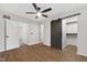 A bright bedroom features a ceiling fan and open closet with shelving and hanging space at 129 Assembly Ct, Cary, NC 27511