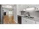 This kitchen shows white cabinets, stainless appliances, and granite countertops at 129 Assembly Ct, Cary, NC 27511