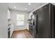 Modern kitchen featuring stainless steel appliances, granite countertops, and ample cabinet space at 129 Assembly Ct, Cary, NC 27511