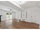 Spacious living area with hardwood floors, fireplace, and sliding doors providing natural light at 129 Assembly Ct, Cary, NC 27511