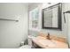 This bright bathroom has a window, toilet and vanity at 1413 Roy Averette Dr, Raleigh, NC 27603