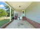 Covered carport with an exterior access door and plenty of space for parking and storage at 1413 Roy Averette Dr, Raleigh, NC 27603