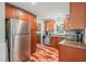 Well-equipped kitchen with stainless steel appliances, granite countertops, and wooden cabinets at 1413 Roy Averette Dr, Raleigh, NC 27603