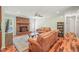 Comfortable living room with a brick fireplace, hardwood floors, and light green walls at 1413 Roy Averette Dr, Raleigh, NC 27603