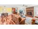View of living room leading to dining area, with hardwood floors and a brick fireplace at 1413 Roy Averette Dr, Raleigh, NC 27603