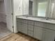 Bathroom featuring a double vanity with granite countertops and modern fixtures at 148 Coharie Dr, Lillington, NC 27546