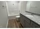 Modern bathroom featuring vanity with granite countertops and shower-tub combo at 148 Coharie Dr, Lillington, NC 27546