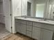 Bathroom featuring a double vanity with granite countertops and modern fixtures at 148 Coharie Dr, Lillington, NC 27546