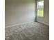 Carpeted bedroom offers a serene and comfortable living space with natural light at 148 Coharie Dr, Lillington, NC 27546