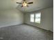 Bright bedroom with neutral walls, plush carpeting, ceiling fan, and lots of natural light at 148 Coharie Dr, Lillington, NC 27546