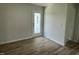 Mud room featuring durable wood-look vinyl flooring and access to the home's rear entrance at 148 Coharie Dr, Lillington, NC 27546