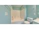 Fresh bathroom with a shower-tub combo, white tiling, and modern fixtures at 151 Braeside Ct, Cary, NC 27519