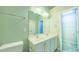 Bathroom features a double sink vanity with framed mirror and stylish lighting at 151 Braeside Ct, Cary, NC 27519