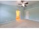 Bright, carpeted bedroom with ceiling fan and ensuite bathroom access at 151 Braeside Ct, Cary, NC 27519